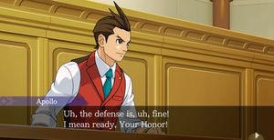Screenshot of Apollo Justice: Ace Attorney Trilogy - Apollo at the defence attorney's bench saying 'Uh, the defence is, uh, fine! I mean ready, Your Honour!'