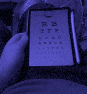 An iPad Mini with an optician's eye chart viewed through the Steam Frame. Visual consistency starts breaking down fairly quickly.